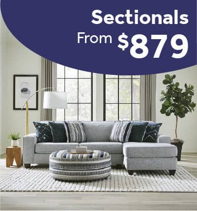 Persia Indigo sectional sofa with plush cushions in a contemporary living room.